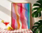 Rainbow waves print styled with a cocktail, lemons, and tropical leaves