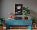 SN 1987A supernova wall art above a blue console with plants