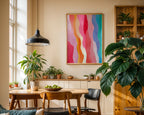 Rainbow waves print displayed in a plant-filled dining room