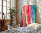 Rainbow waves print leaning in a sunlit bedroom beside a cello
