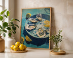 Oyster still life print displayed with lemons and green plants