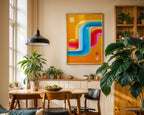 Neon abstract print displayed in a plant-filled dining room