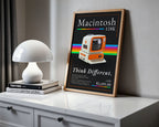 Retro Macintosh 128K print on a white cabinet beside a dome lamp