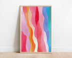 Rainbow waves print in a pale wood frame against a white wall