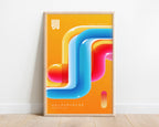 Neon abstract print in a pale wood frame against a white wall